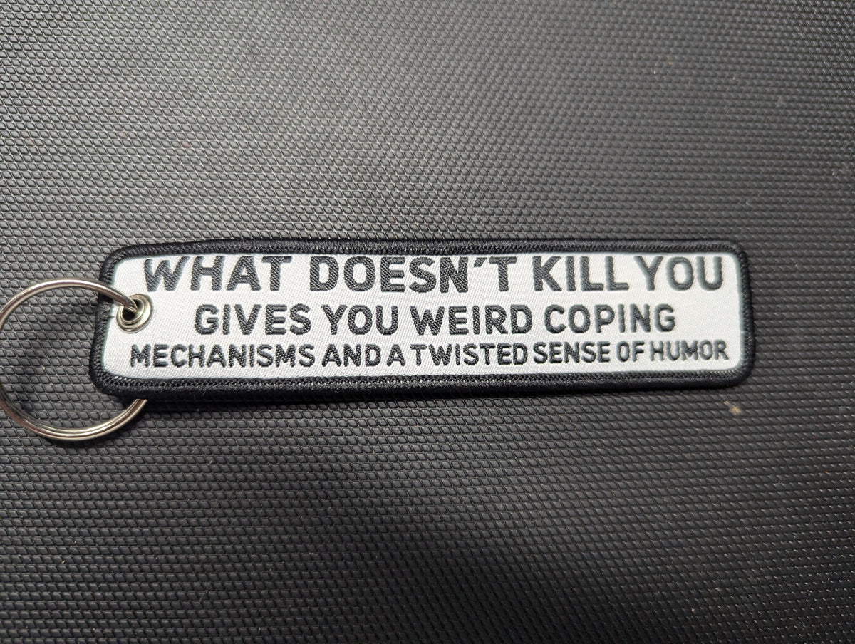 What Doesn't Kill You Keychain — Weird Coping Mechanisms